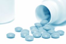 Spilled Round Tablets (blue Toned) Royalty Free Stock Photos