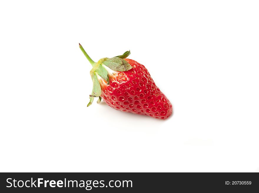 This is a fresh, bright red strawberry shot on a white background. It is cute shaped so it can work nicely with healthy eating concepts. This is a fresh, bright red strawberry shot on a white background. It is cute shaped so it can work nicely with healthy eating concepts.