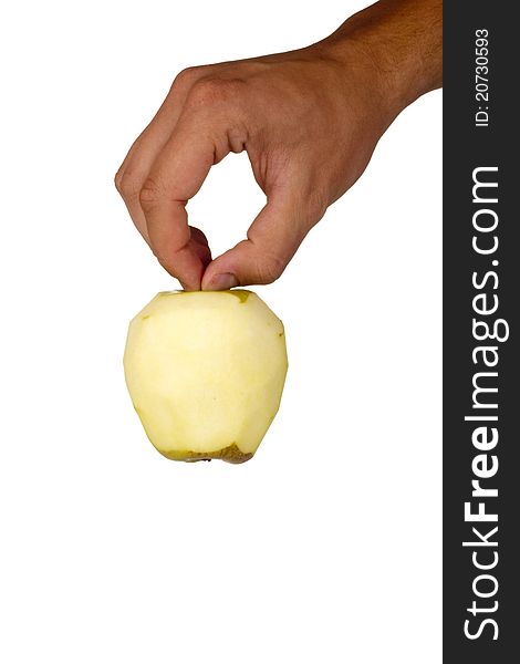 Peeled Fuji apple in a hand isolated on a white background.