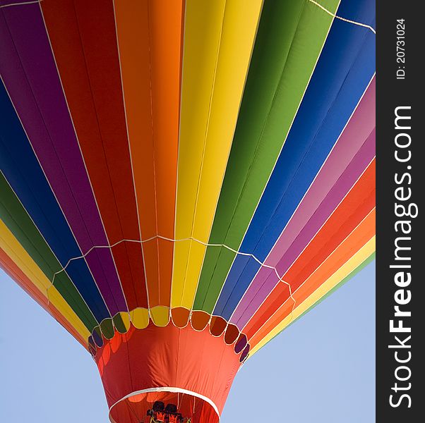 Colorful Hot Air Balloon Ascending into the summer sky. Colorful Hot Air Balloon Ascending into the summer sky