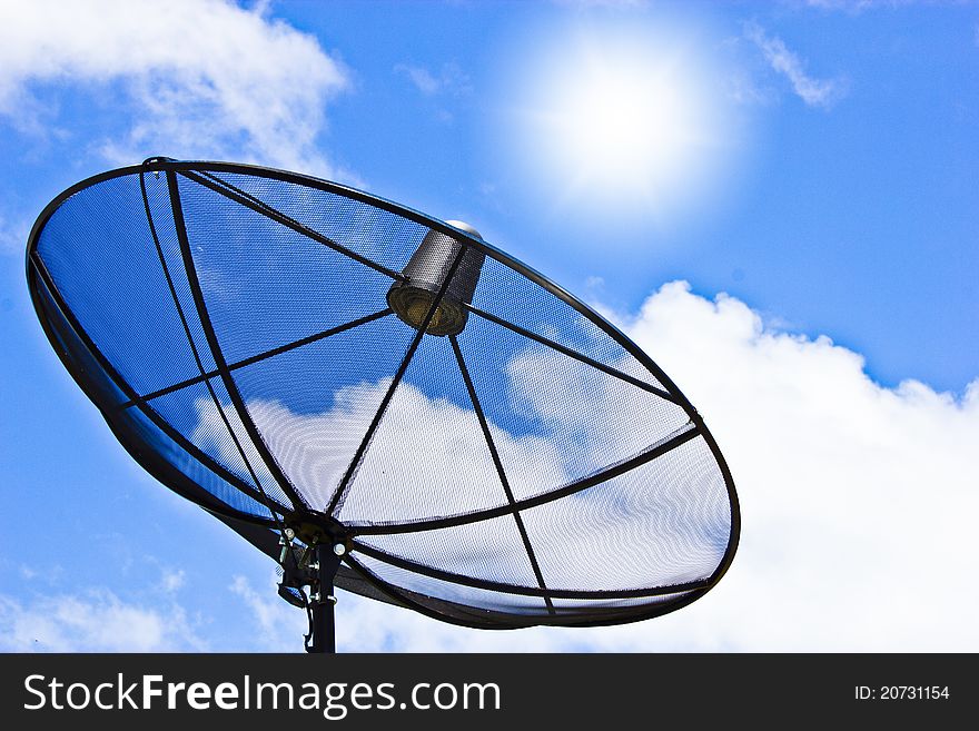 Satellite dish on blue sky