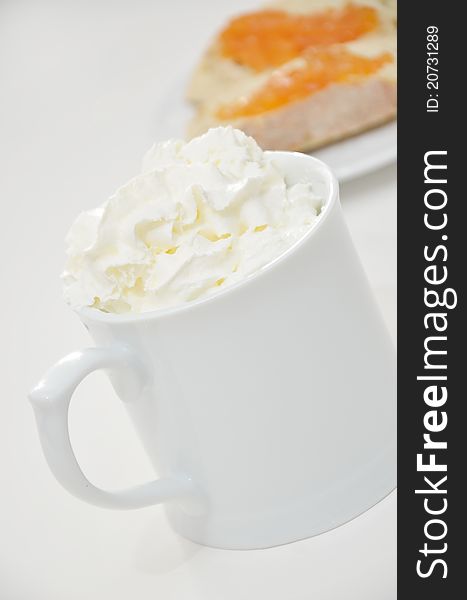 Mug of hot beverage whipped cream and toast. Mug of hot beverage whipped cream and toast