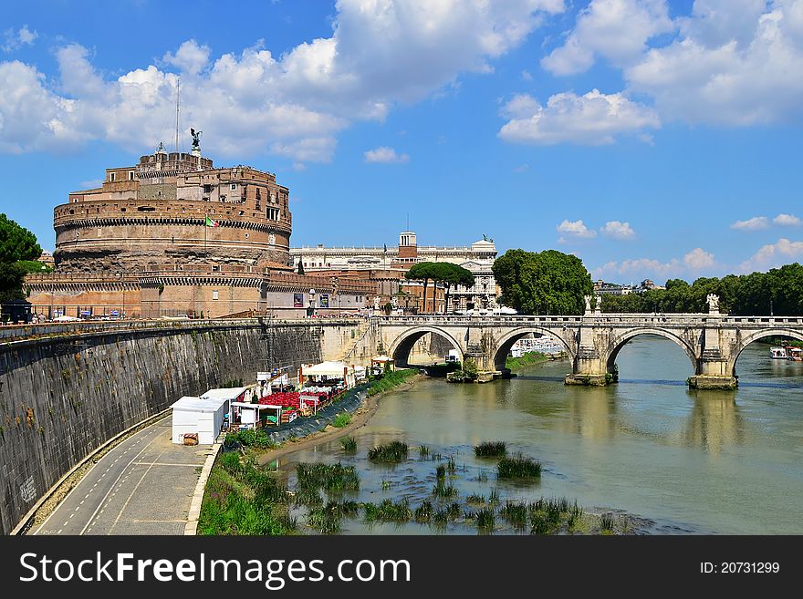 The Mausoleum of Hadrian, usually known as the Castel Sant'Angelo, is a towering cylindrical building in Rome. It was initially commissioned by the Roman Emperor Hadrian as a mausoleum for himself and his family. The Mausoleum of Hadrian, usually known as the Castel Sant'Angelo, is a towering cylindrical building in Rome. It was initially commissioned by the Roman Emperor Hadrian as a mausoleum for himself and his family.