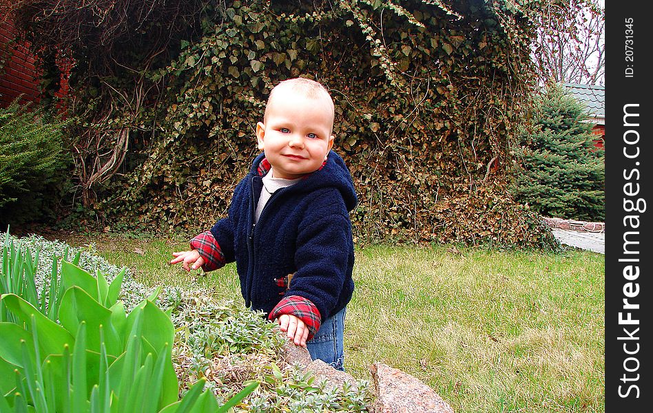 The Kid Playing In The Garden