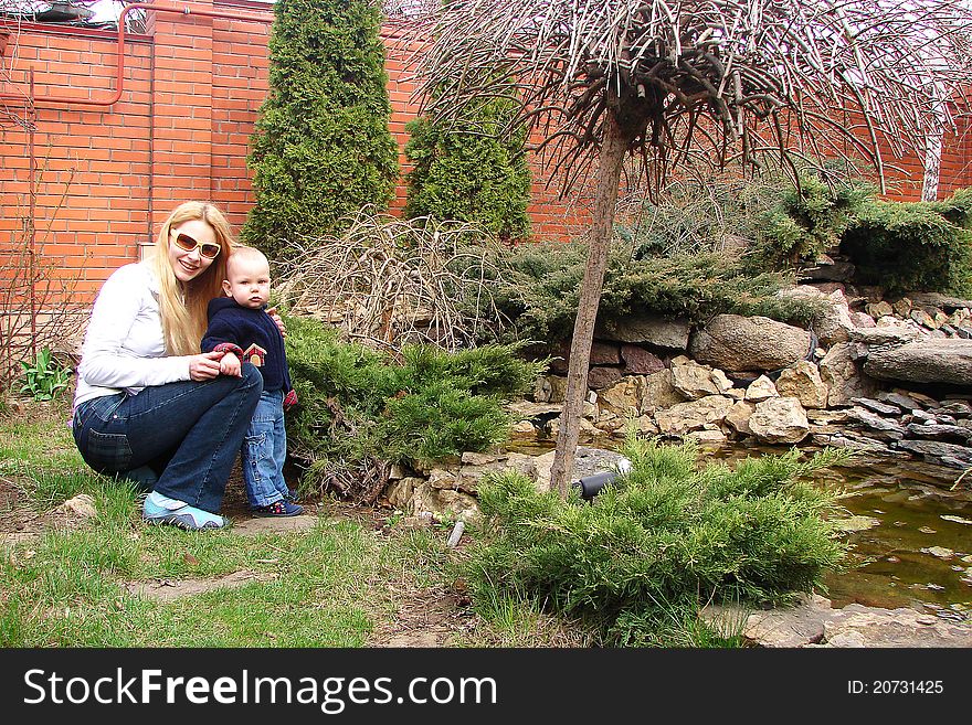 Mother and son in the garden of his house