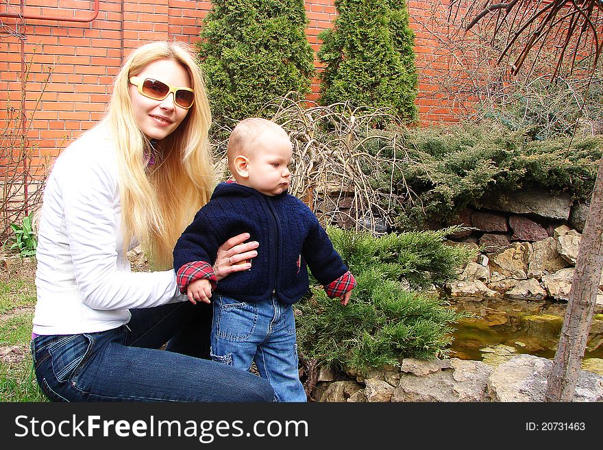 Mother and son in the garden of his house