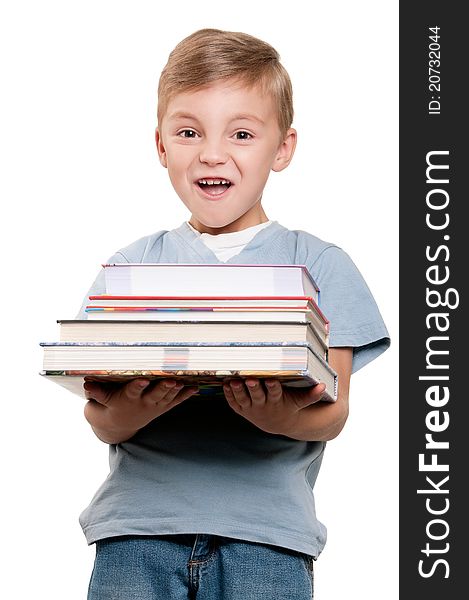 Portrait of a funny little boy holding a books over white background. Portrait of a funny little boy holding a books over white background