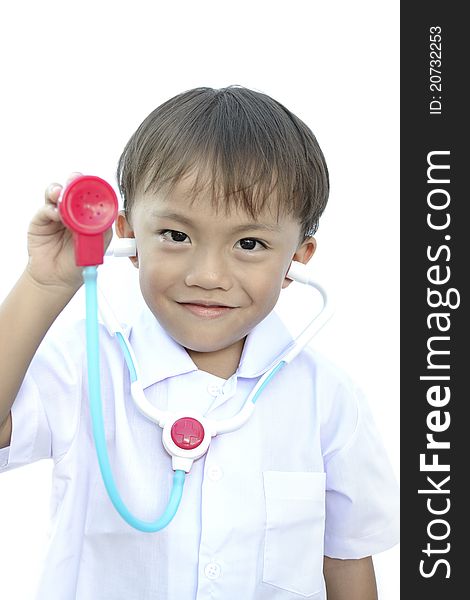 Young asian boy in doctor uniform on white background.