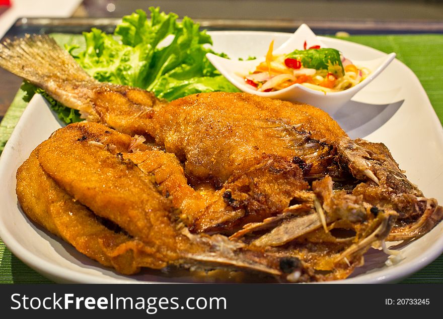 Fried snapper with mango salad. Fried snapper with mango salad