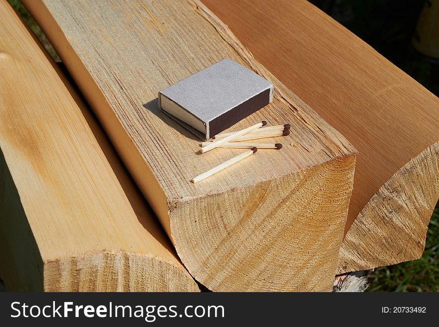 Matchbox and matches on the wood