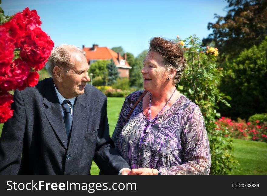Very old man (92) with his wife in summer garden. Very old man (92) with his wife in summer garden