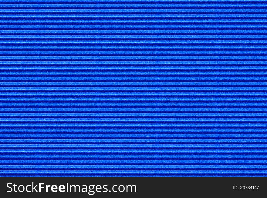 Seamless texture of blue corrugate cardboard