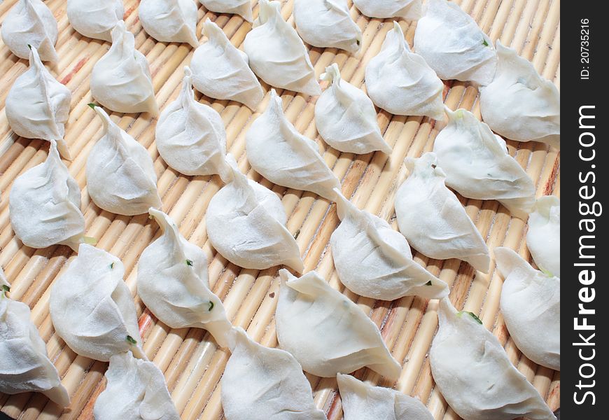Cooking Dumplings with white paste and flour.