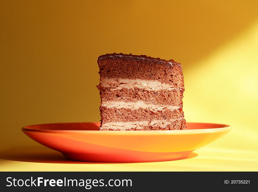 A piece of freshness chocolate sponge cake on saucer