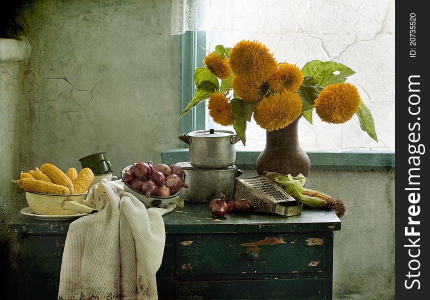 Bouquet of sunflowers, corn and bow on a table