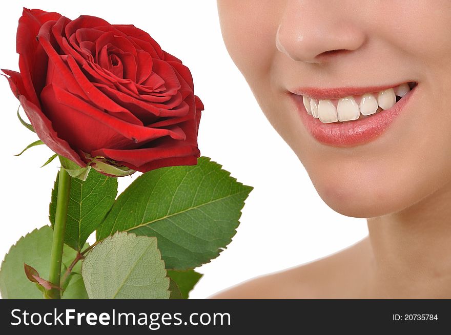 Closeup of a smiling young woman with red rose. Closeup of a smiling young woman with red rose