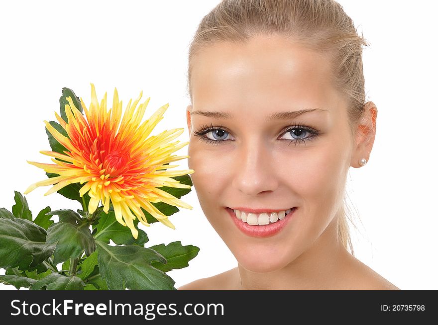 Smiling woman shows a flower