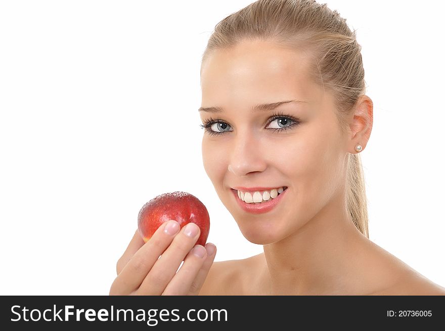 young woman holding a red nectarine. young woman holding a red nectarine