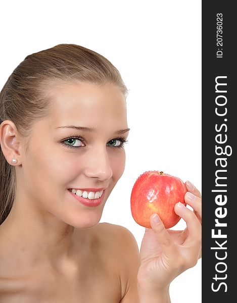 Sexy young woman with green eyes holding an apple
