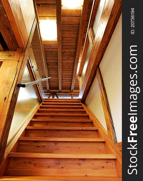 New wooden stairs in bright interior