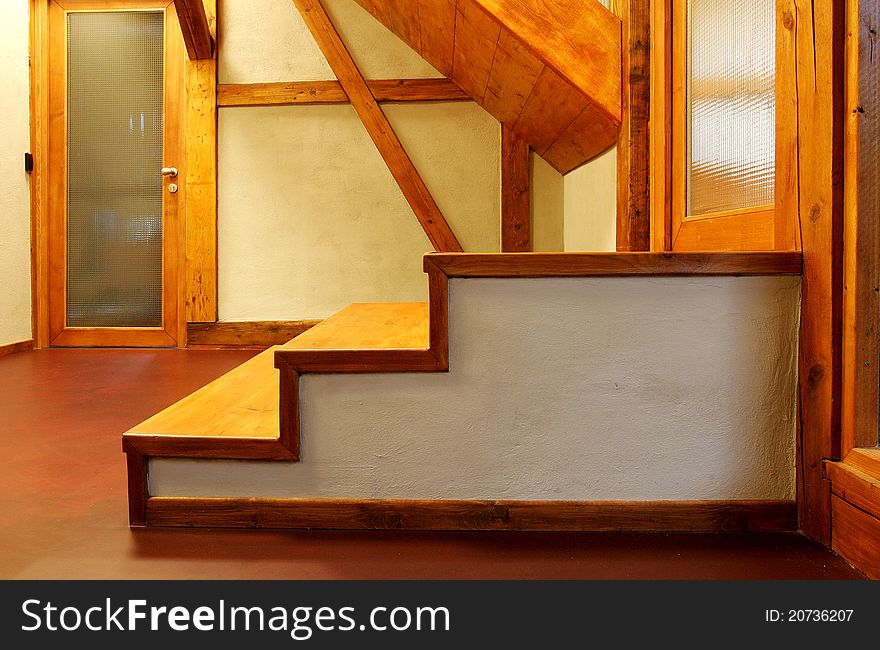 New wooden stairs in bright interior