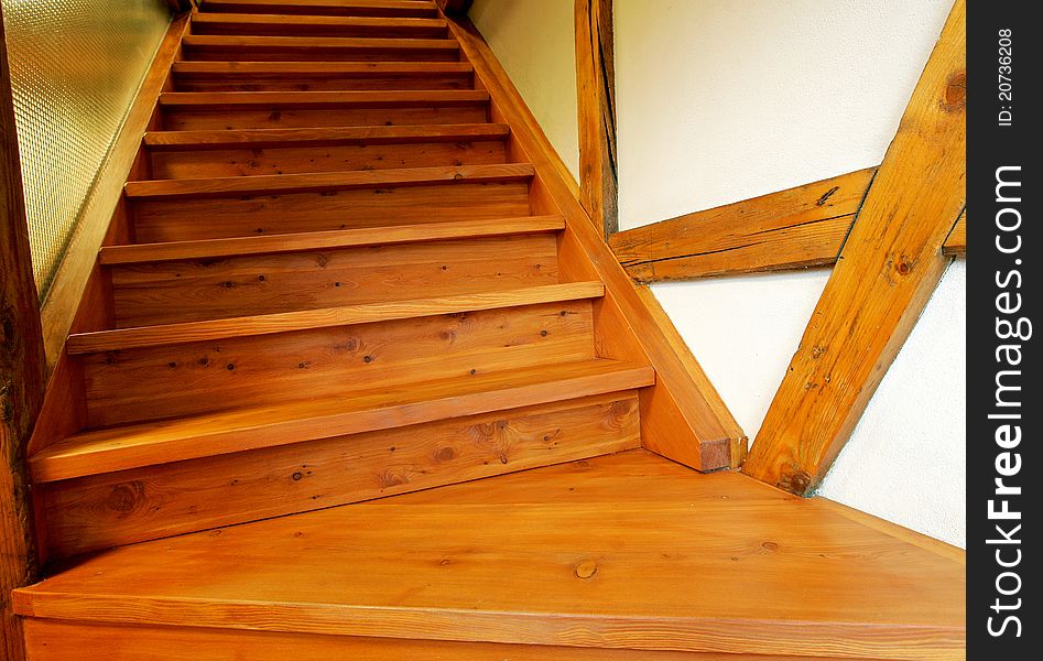 New wooden stairs in bright interior