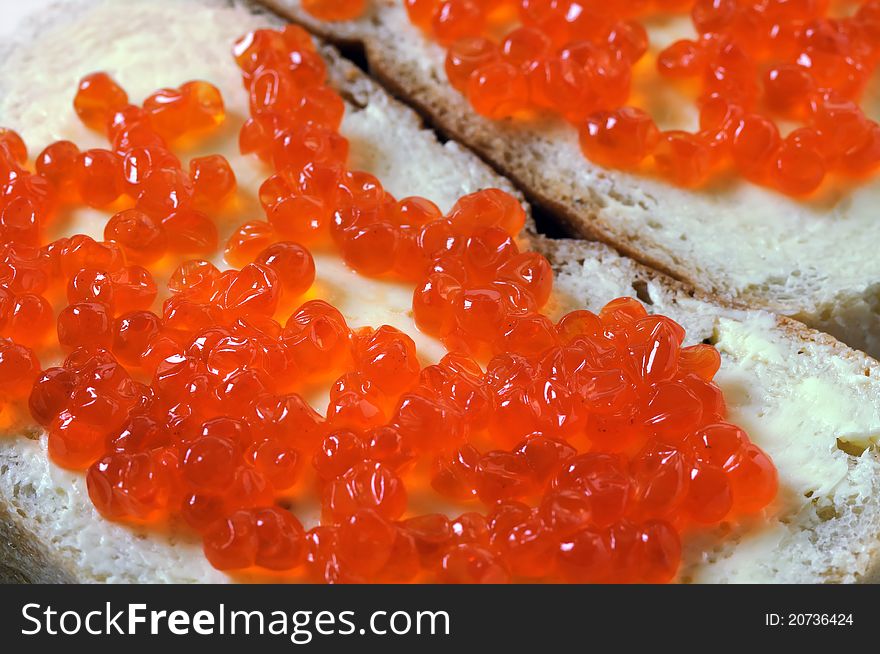 Close-up of red caviar with bread and butter