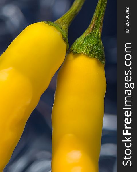 Close-up of two yellow chili pepper