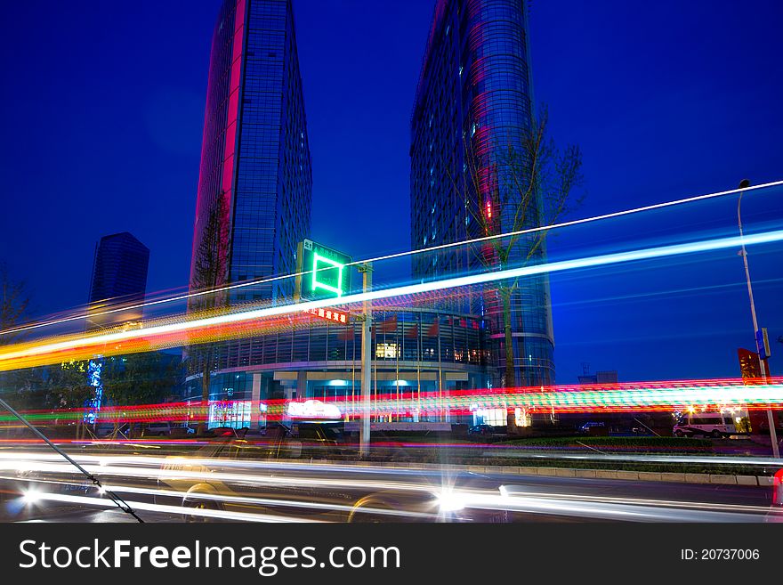 The light trails on the modern building background in shanghai china.