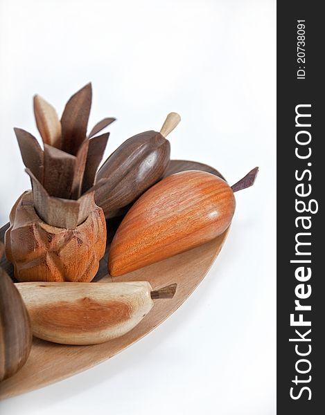 picture of wooden fruits for decoration has more than enough white bottom