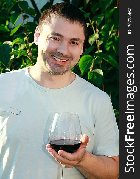 Handsome man drinking wine outdoor