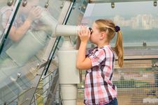 A Girl Looks Through A Telescope Royalty Free Stock Image A Girl Looks Through A Telescope Royalty Free Stock Image