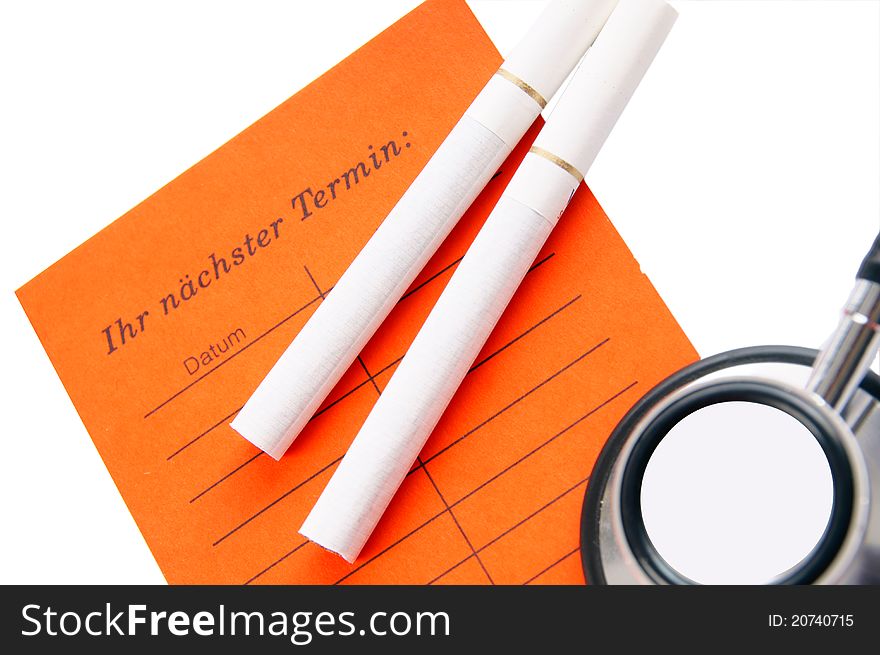 Cigarettes with stethoscope and date reminder. Cigarettes with stethoscope and date reminder