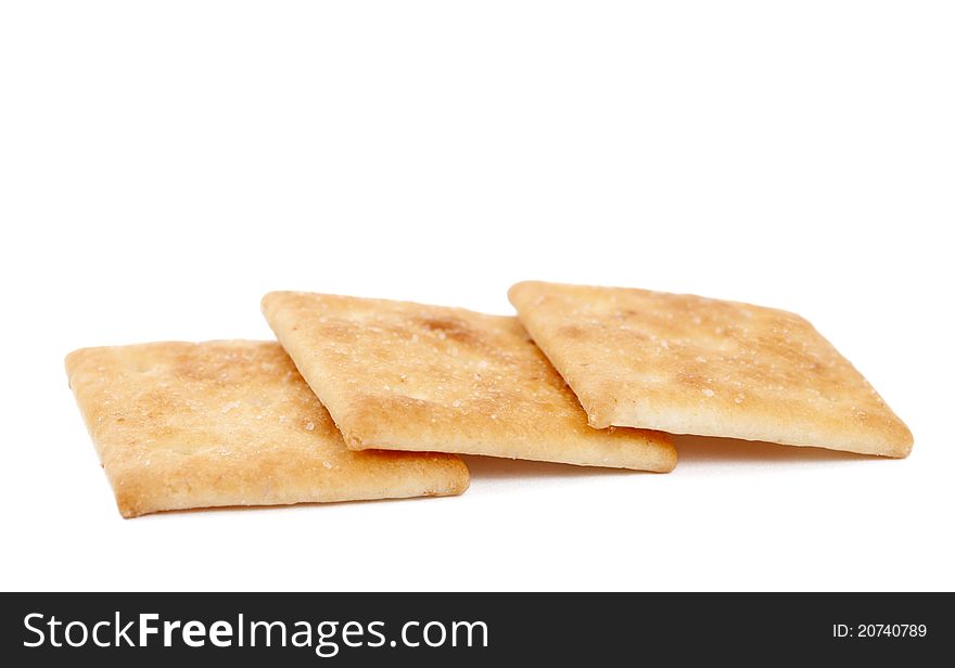 Salty crackers on white background