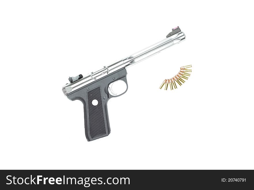 A pistol and ammunition against a white background. A pistol and ammunition against a white background