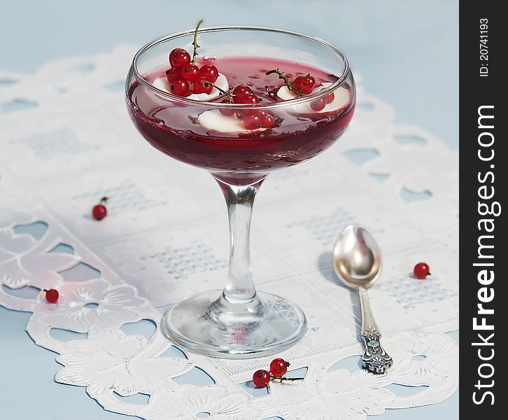 Red currant preserve in glass at white background. Red currant preserve in glass at white background