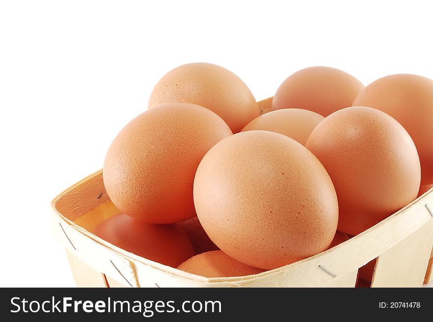 Eggs in a basket close on a white background