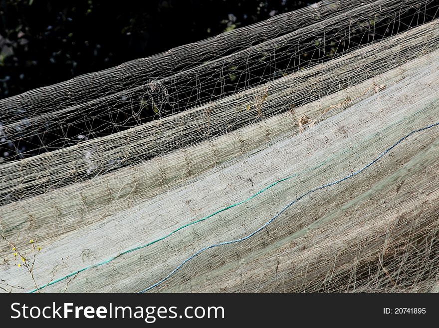 Fishing nets hung out to dry. Shallow depth of field. Fishing nets hung out to dry. Shallow depth of field.