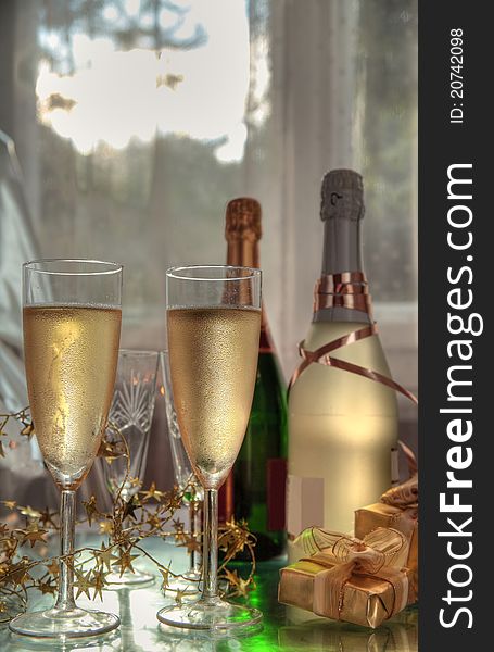 Champagne In Glasses, Gift Box And Sunbeam