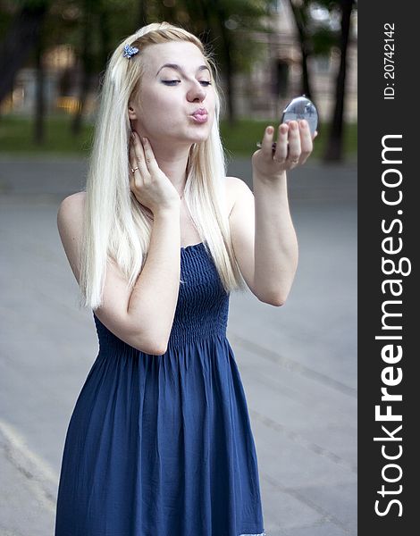 Portrait of young woman in small mirror. Portrait of young woman in small mirror