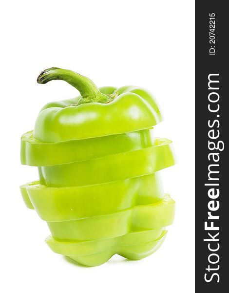Cutted sweet green pepper over white background