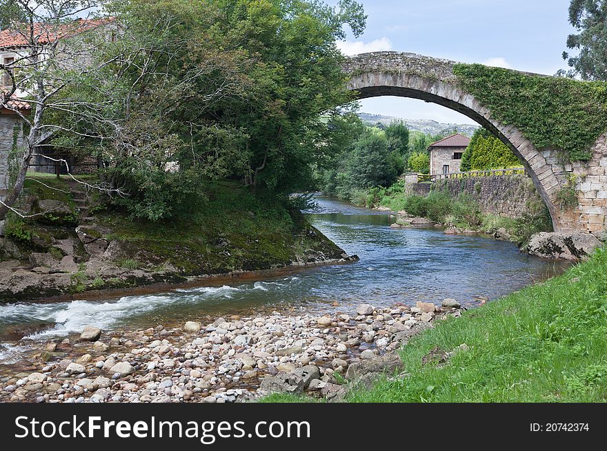 Medieval bridge over a river in the province of Cantabria in northern Spain. Medieval bridge over a river in the province of Cantabria in northern Spain