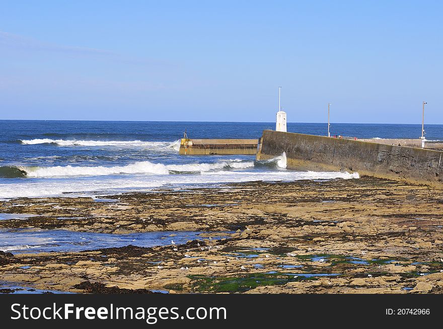 The Harbour entrance to a small fishing village called Seahouses on the North Eastern coast of England. The Harbour entrance to a small fishing village called Seahouses on the North Eastern coast of England.