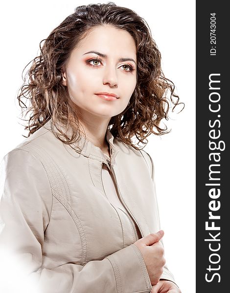 Studio portrait of a young girl with curly hair and bright makeup isolated on white. Studio portrait of a young girl with curly hair and bright makeup isolated on white