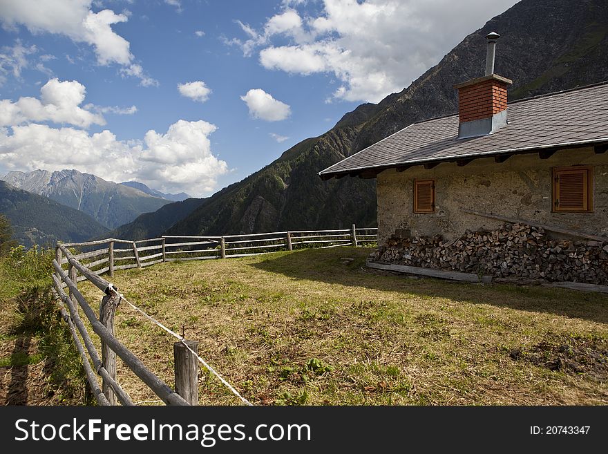 Brick house in the mountains looking over a valley