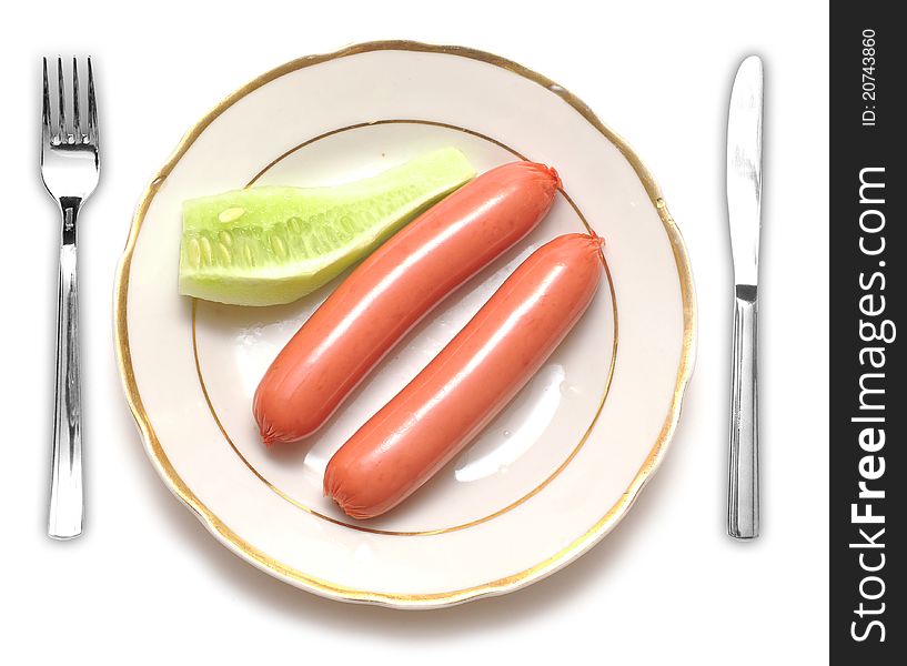 Sausages and cucumber on white