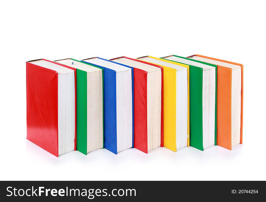 A line of many blank colorful book covers isolated on white background