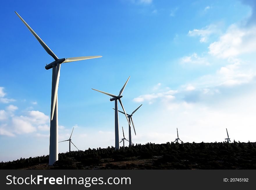 Wind turbines, sunset time. Region of perpignan, summer time. Wind turbines, sunset time. Region of perpignan, summer time.