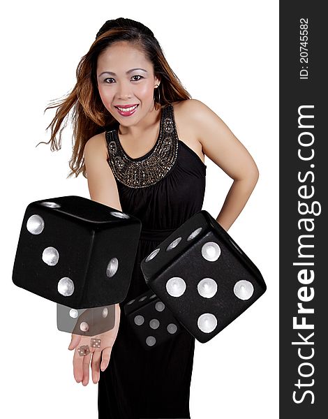 Asian Female Tossing a Pair of Black Dice. Asian Female Tossing a Pair of Black Dice