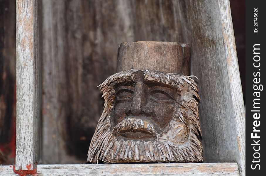 Face of human carved from bamboo